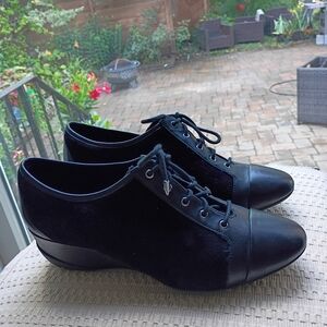 NWT.Rockport women's shoes featuring a lace-up design and a wedge heel.Size 8.5